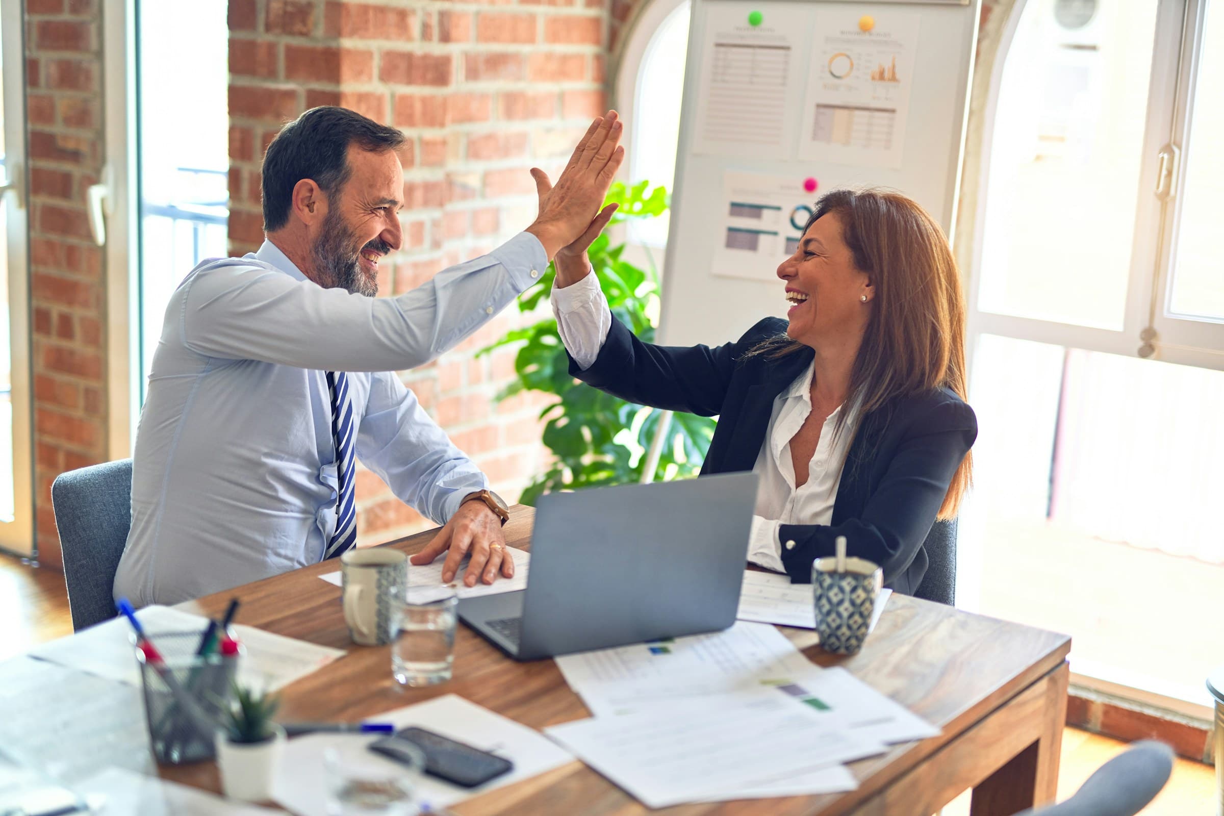A SMAART Loans advisor celebrating a successful outcome with a client